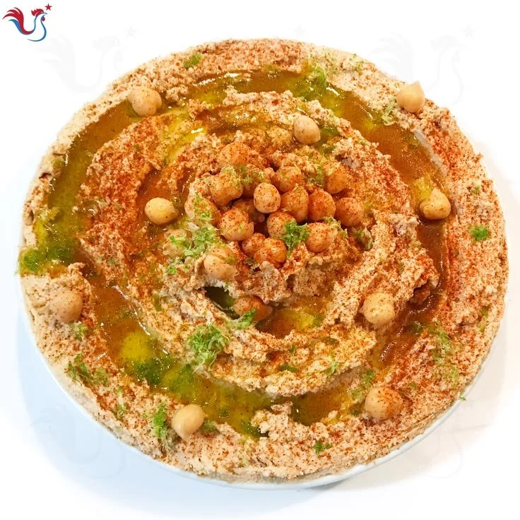 Recette de Houmous de Yotam Ottolenghi avec ingrédients frais et aromatiques.