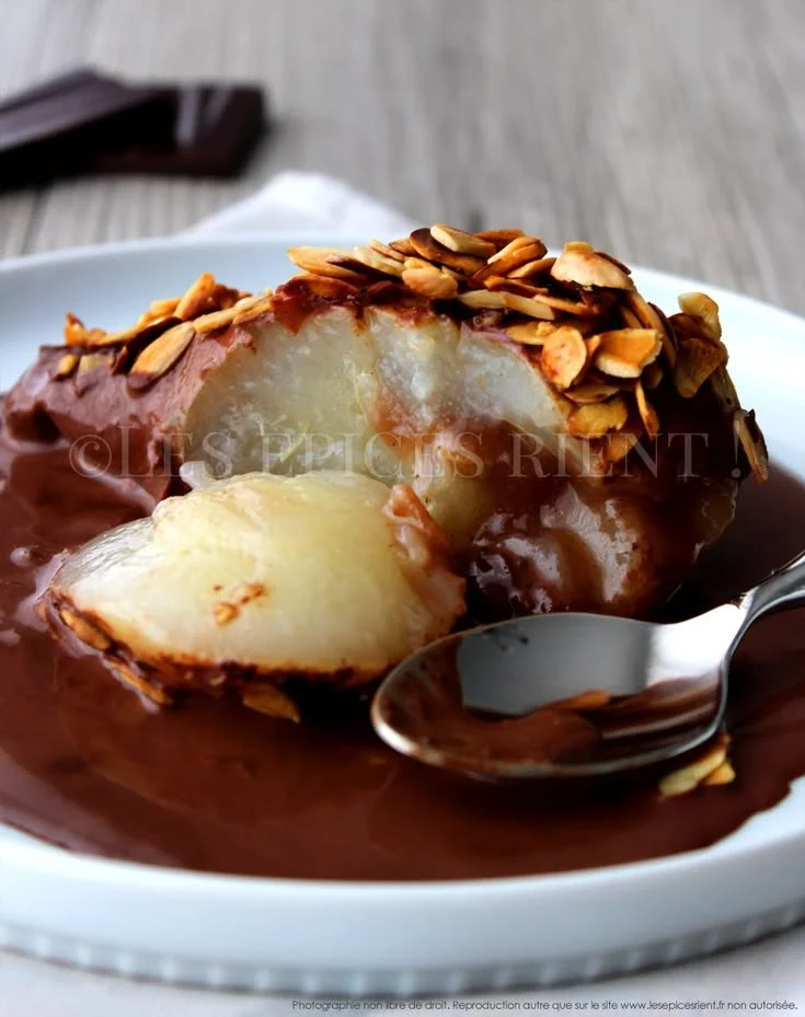 Delicious poires au chocolat topped with crunchy almonds, a perfect dessert