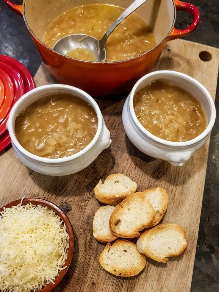 Delicious homemade soupe à l'oignon gratinée topped with melted cheese