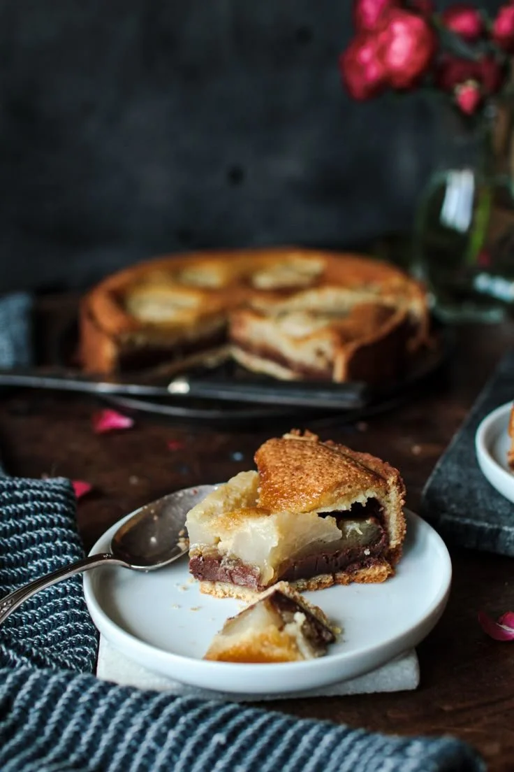 Delicious Tarte aux poires with chocolate and almonds in a tart shell